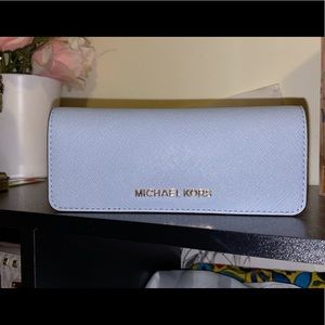 MICHAEL KORS light blue wallet.